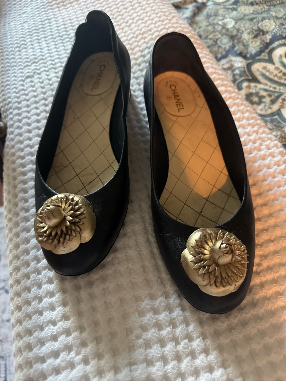 CHANEL Black Flats with Gold Camillia Detail
